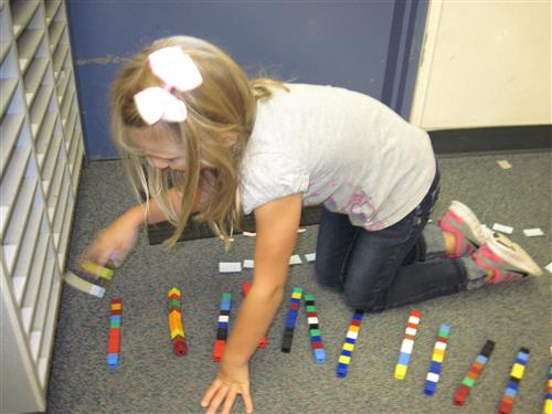 Student counting with math manipulatives 